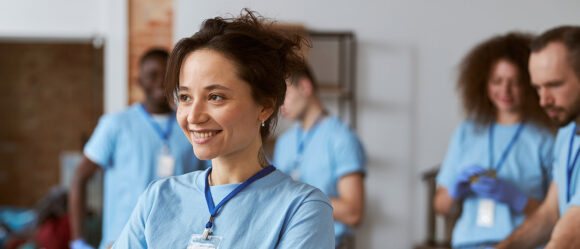 Clinician confidently coordinating care in a clinical setting.