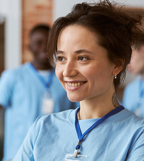 Clinician confidently coordinating care in a clinical setting.