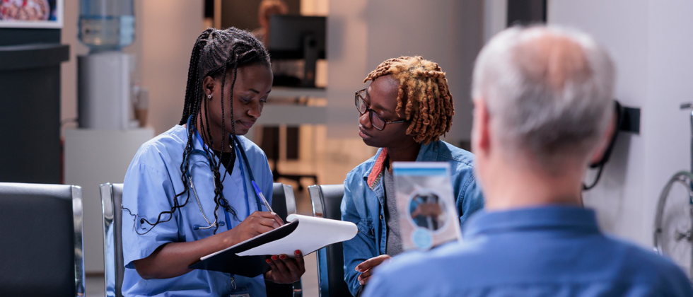 Clinician speaking with a patient virtually, supportive conversation.